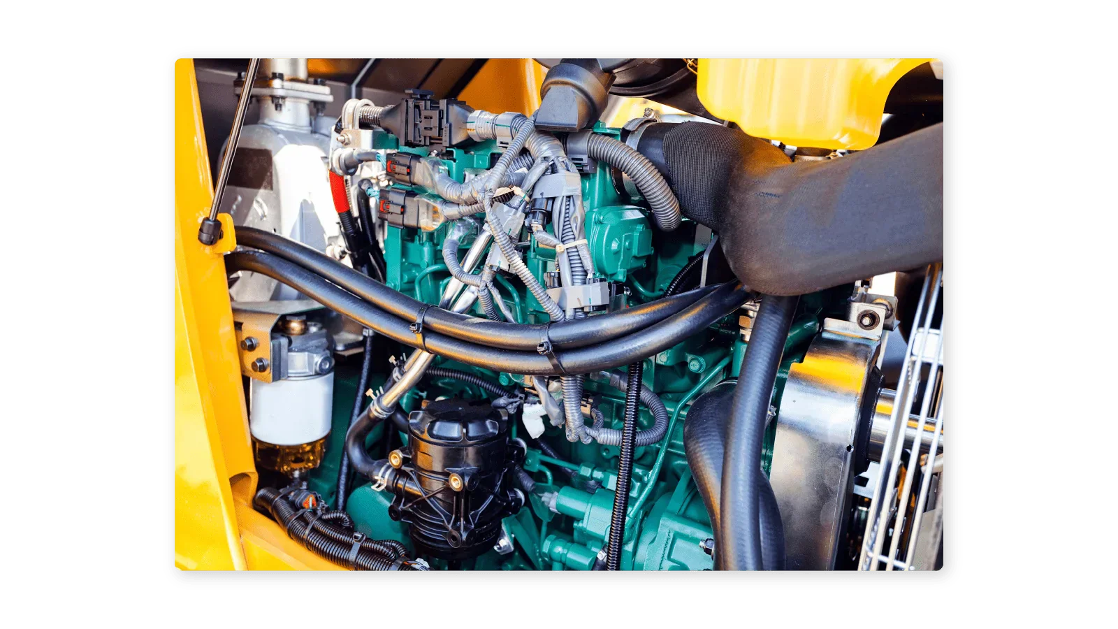 Wiring around an excavator engine.