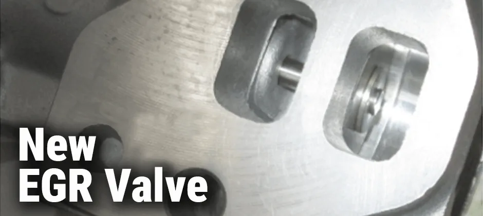 Close-up of the clean, metallic ports on a new EGR valve before installation.