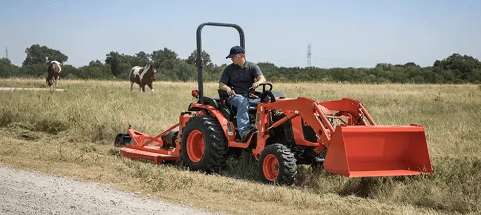 A-person-is-operating-a-small-tractor-on-the-farm.